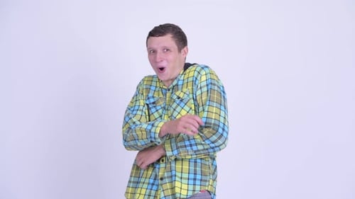 Ecstatic Man Celebrates Success in an Indoor Setting