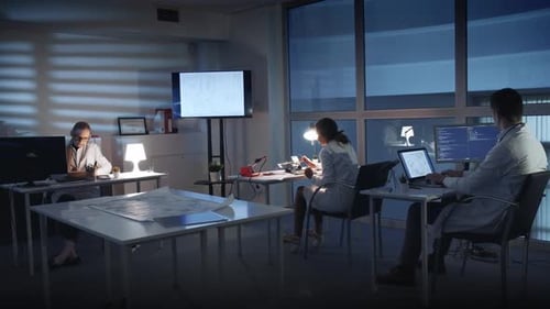 Scientists Working Late at Night in Laboratory