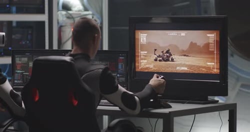 Man Controls Mars Rover from Futuristic Workspace