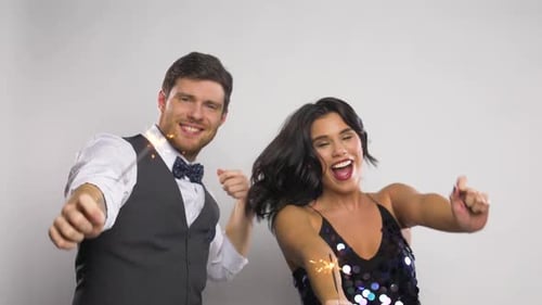 Happy Couple Dancing with Sparklers