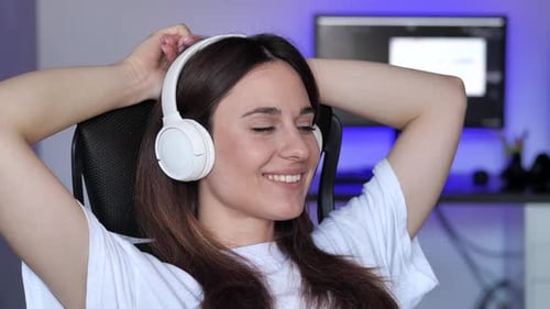 Woman Relaxing with Headphones On