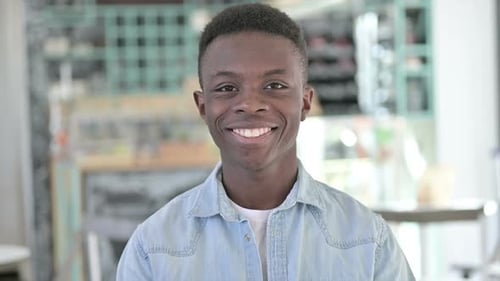 Smiling Young Adult Portrait in Bright Indoor Setting