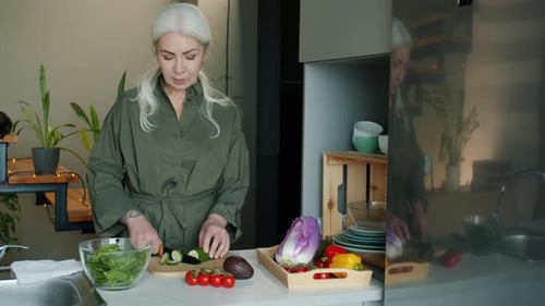 Woman Preparing Healthy Salad in Modern Kitchen