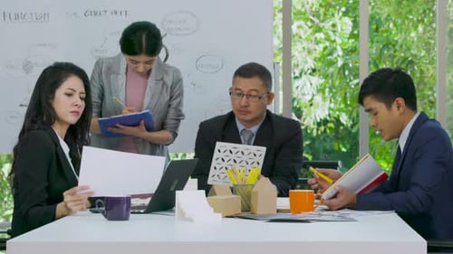 Team Collaboration Meeting in Modern Office Environment