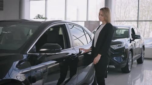 Portrait of an Elegant Business Lady in a New Car Dealership