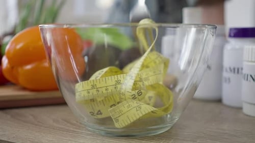 Tape Measure being Stirred in a Bowl