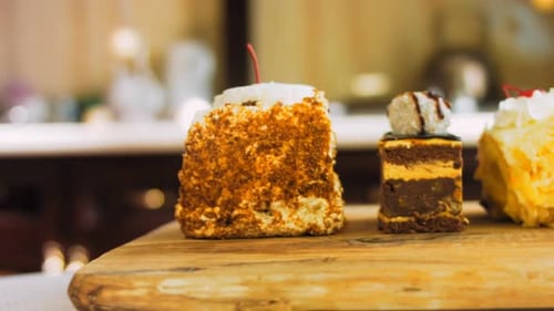 Delicious Slices of Cake on Wooden Platter