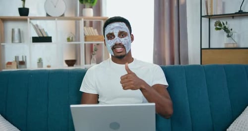 Smiling Man With Face Mask Gives Thumbs Up