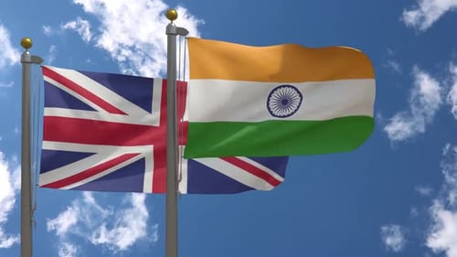 United Kingdom Flag Vs India Flag On Flagpole