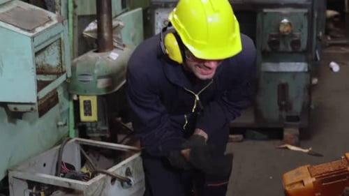 Factory Worker Injured By Accident While Using Machine in Factory