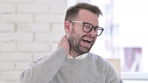 Man Experiencing Intense Neck Pain, Close Up