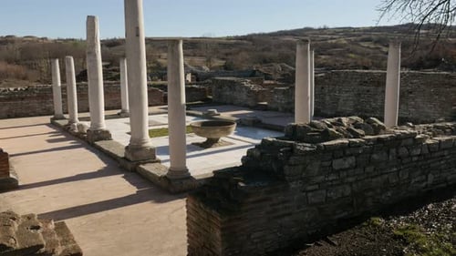 GAMZIGRAD, SERBIA - DECEMBER 25, 2017 Fountain and high columns in Felix Romuliana palace built by