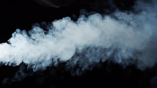 White Smoke Billowing Horizontally on Black Background