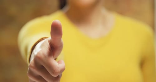Hand Points Index Finger in Front of Frame