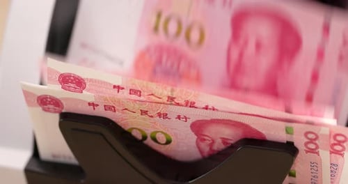 Close Up of Renminbi Counting Machine in Operation