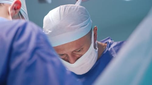 Medical team performing surgery. Surgical team performing surgery in modern operation theater
