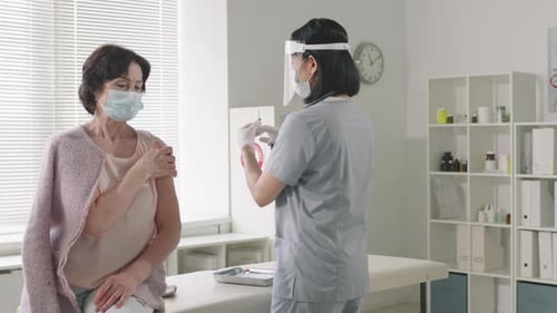 Senior Lady Gets Vaccinated At Hospital