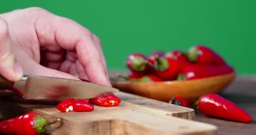 Cutting Red Chili Pepper on Cutting Board