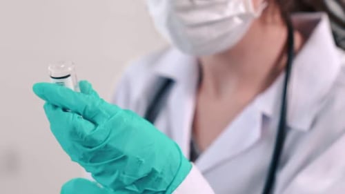 Skillful Doctor Prepare Vaccine Proficiently Before Injection