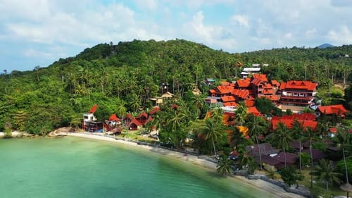 Tranquil bay with calm turquoise lagoon washing sandy exotic beach and cliffs of tropical island sho