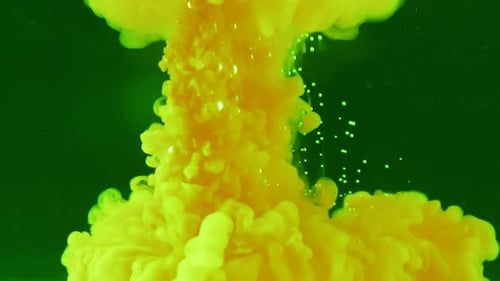 Bright Yellow Fluid Cloud Expanding on Green Background
