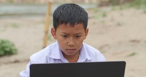 Asian Boy Using Computer