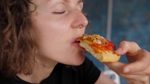 Young Hungry Woman Biting Vegan Pizza