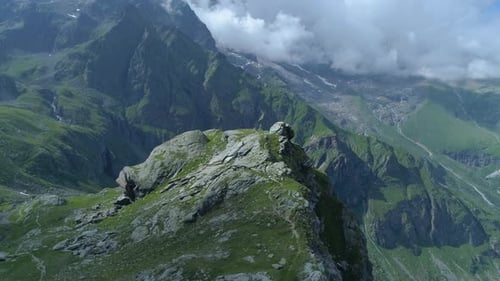 Moving Forward Over Majestic Alpine Mountain Valley with Lakes in Sunny Cloudy Summer