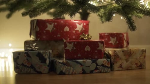 Christmas Presents under Tree with Warm Lighting