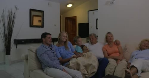 Family Relaxing Together on Couch in Living Room
