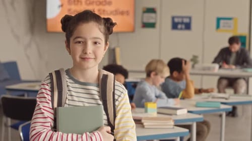 Portrait of Pretty School Girl in Classroom