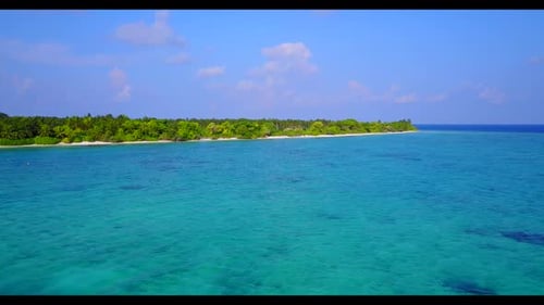 Aerial drone shot panorama of tranquil island beach break by blue lagoon with white sand background