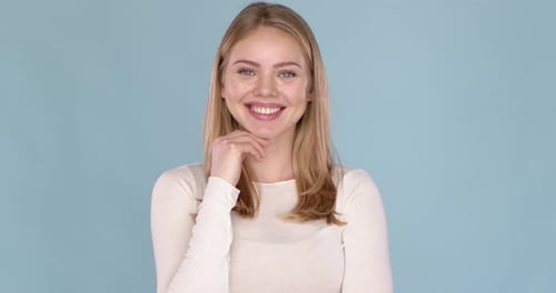Smiling Young Woman Portrait on Blue Background