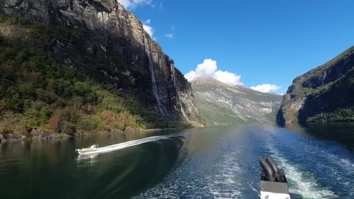 View froming ferry on motor boat crossing the Geiranger fjord in Norway. Impressive Mountains
