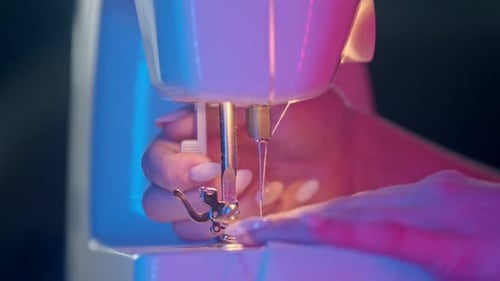 Sewing Machine Needle at Work Close Up