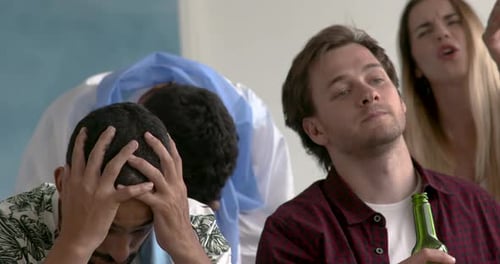 Group of Friends Reacting with Frustration Indoors