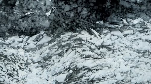 An Aerial View From Above on the Frozen Reservoir. Cracks and Shards of Ice Look Spectacular. Low