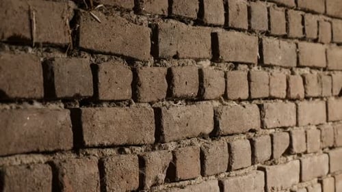 Old bricks headers and stretchers close-up slow-tilt 4K 2160p 30fps UltraHD footage - Weathered hou