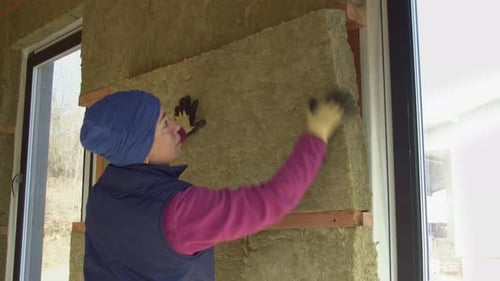 Woman Laying Insulation