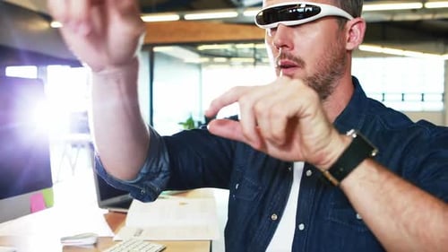 Man in Futuristic Glasses Interacting with Virtual Interface