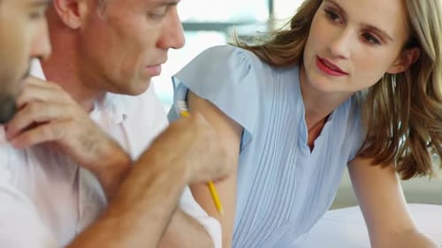 Business people working together at table in a modern office