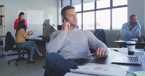 Businessman on the phone in modern office