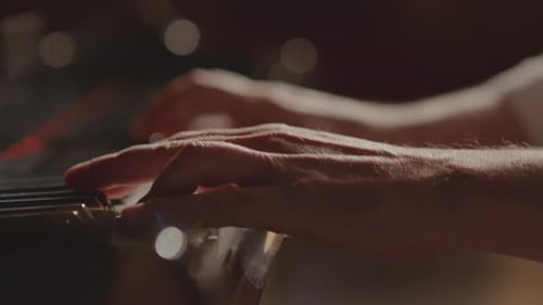Close Up of Male Hands Playing Piano
