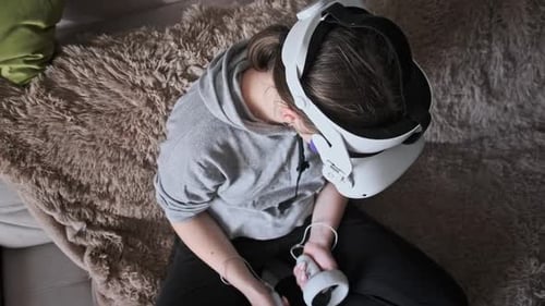 Woman Experiencing Virtual Reality with VR Headset at Home