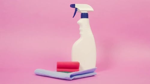 White Plastic Spray Bottle with Household Chemicals for Cleaning the House