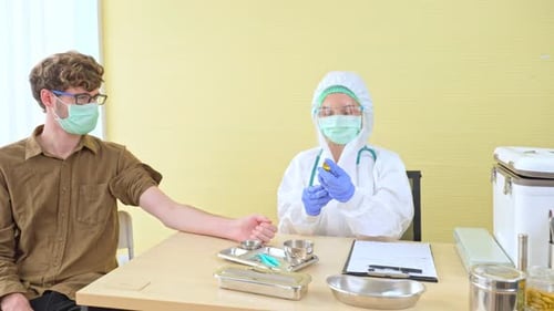 Vaccine Injection by Health Professional in Clinic