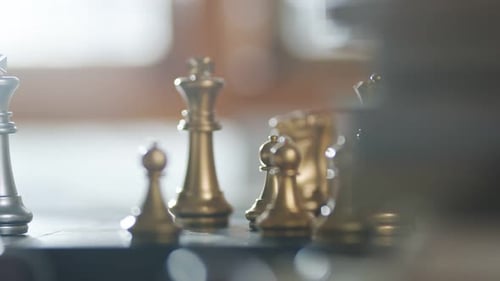 dolly shot of close up chess board game business strategy ideas concept with blur bokeh background