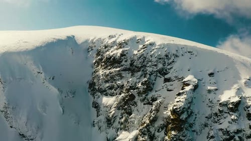 Flying to Snowy Mountain Peak