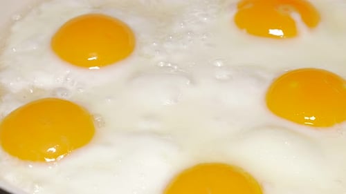 Close Up of Eggs Frying in Pan