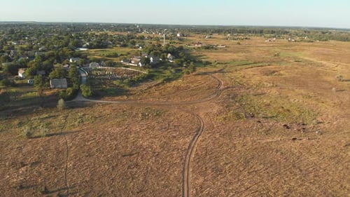 Aerial View of the Countryside and Small Village with Green Fields and Meadows